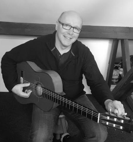 Andrew Clemson playing his guitar